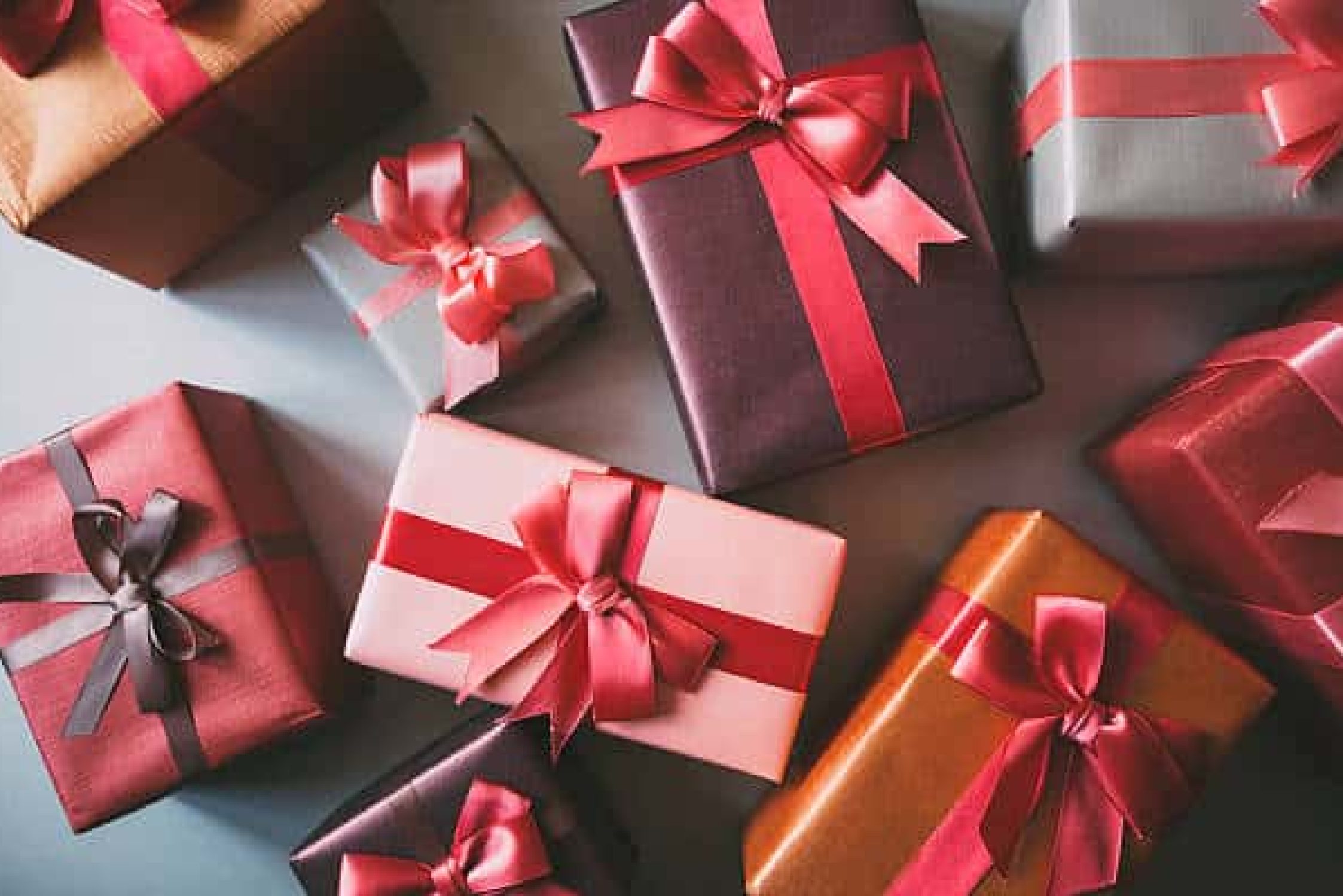 Stylishly packaged boxes with gifts closeup.